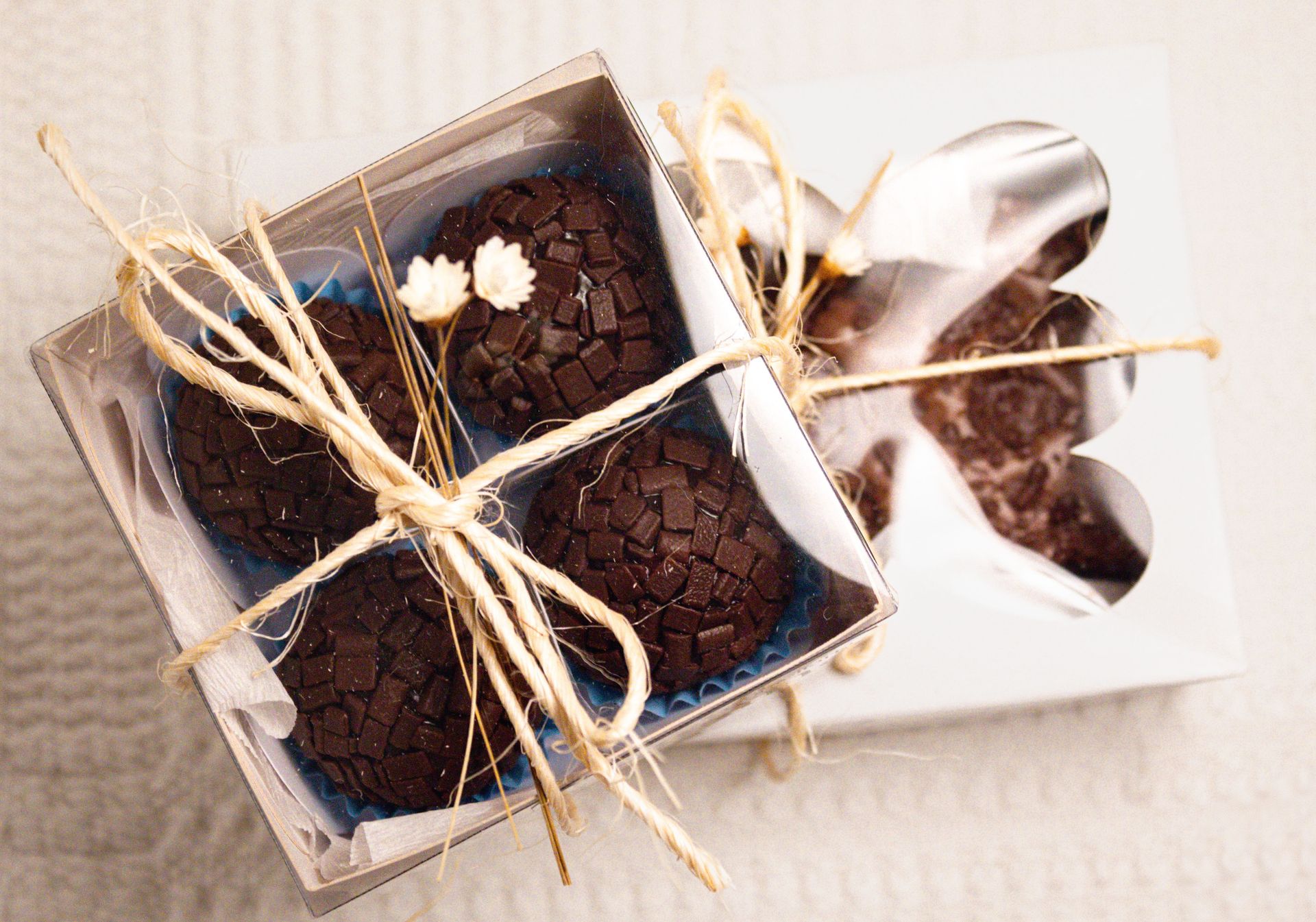 Beautifully presented gourmet chocolate truffles in a gift box tied with twine. Perfect for gifting.